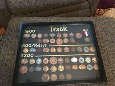 there is a framed display with coins on it