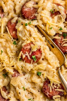 pasta with sausage and parmesan cheese in a casserole dish, ready to be eaten