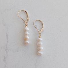 Gold Plated leverback earwire with either  4 freshwater Pearls  or  2 gold plated beads and 2 Brown glass beads freshwater pearls very  in shape and no two are alike  beautiful great for weddings or Bridesmaids gift but also great for everyday wear or a night out Coin Pearl Earrings, Pearl Earrings Gold, Baroque Pearl Earrings, Coin Pearls, Gold Pearl Earrings, Beaded Drop Earrings, Freshwater Pearls Earrings, Earrings Pearl, Teardrop Beads