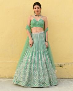 Organza based lehenga with symmetric zardosi patterns paired a ruched bralette with an accentured neckline and an effortless tulle dupatta finished with long dangling pearl tasselsFrom Chamee and Palak’s Shadows collection DELIVERY TIMEPlease wait 8-12 weeks for your outfit to arrive FABRIC DETAILSSkirt- Organza Blouse - Silk Dupatta - Net Professional cleaning only Elegant Organza Lehenga With Dori Work, Elegant Lehenga With Dori Work Organza, Wedding Green Hand Embellished Choli, Elegant Navratri Choli With Dori Work, Elegant Georgette Choli With Dori Work, Elegant Gown With Dori Work For Navratri, Elegant Choli With Dori Work For Reception, Elegant Designer Lehenga With Dori Work, Elegant Lehenga With Dori Work For Designer Wear