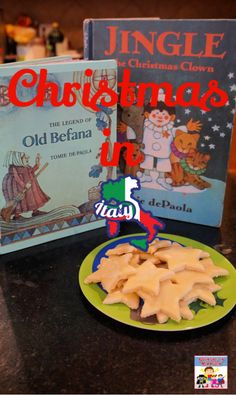 a green plate with cookies on it next to a book about christmas in italy,