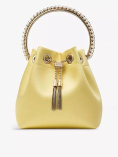 Did someone say, “party bag”? Well, yes, actually; we did – and we’re talking about this iteration from Jimmy Choo. Named after our favourite sweet (well, one of, anyway), the Bon Bon top handle bag is made from silky satin in a suitably rich hue, topped with a drawstring chain that cinches its versatile profile. Pop your evening essentials inside and swing it around by its crystal-strewn handle. Summer Holiday Essentials, Bridal Shoes Flats, Baby Changing Bags, Personalized Chocolate, Bag Boys, Slippers For Girls, Bon Bon, Evening Shoes, Satin Top