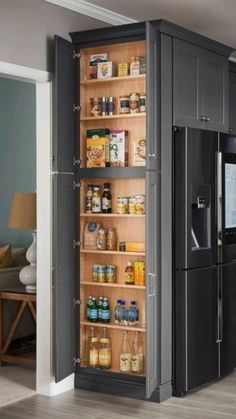 an open refrigerator in the middle of a kitchen