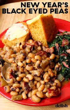 a red plate topped with beans and bread