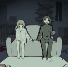 two people sitting on a couch in a living room, one holding the other's hand