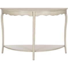 an oval white table with scalloped edges and a shelf on one side,