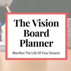 the vision board planner on a desk with a pen and notebook in front of it