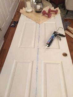 the door is being painted white and ready to be installed