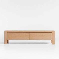 the sideboard is made from wood and has two drawers on one end, and an open drawer on the other