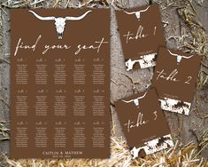 wedding seating chart with longhorns on it and hay in the background for guests to sign