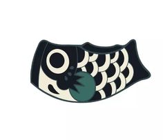 a black and white fish shaped object on a white background