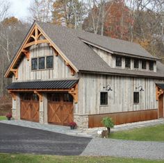 a large house with two garages on the front and one attached to the side