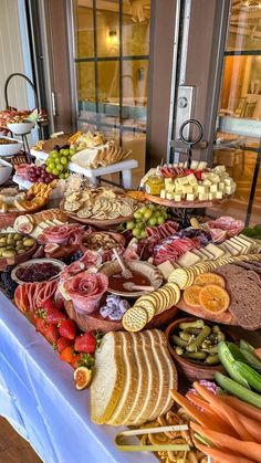 a buffet table filled with lots of different types of food on it's sides