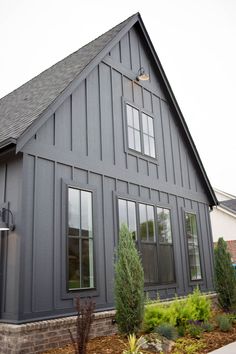 a large gray house with lots of windows