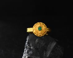 Gold and emerald, what a better combo to highlight the ancient Greek techniques used in the making of this ring. A lovely 22 Karat solitaire ring featuring a 0.12ct emerald stone. The diameter of the disc is 13mm. One of a kind, made especially for you! Handmade in our traditional Greek workshop in the historical center of Athens, with attention to detail and passion for craftsmanship. If you have any questions, please contact us! We will gladly assist you! Other options: ● https://www.etsy.com/ Ancient Yellow Gold Jewelry For Ceremonial Occasions, Ancient Style Yellow Gold Jewelry For Ceremonial Occasions, Ancient Style Yellow Gold Ceremonial Jewelry, Ancient Ceremonial Hallmarked Jewelry, 14k Gold Byzantine Round Ring, 14k Gold Byzantine Style Rings, 14k Gold Byzantine Style Round Rings, Ancient Ceremonial Jewelry, Gold Emerald Ring With Intricate Heirloom Design