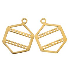 two brass tone metal tags with holes on each side