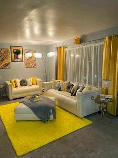 a living room filled with furniture and yellow accents