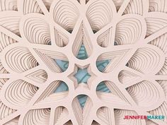 an intricate paper cut design with blue accents