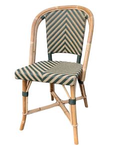 a bamboo chair with an upholstered seat