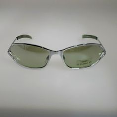 Unisex Fashion Sunglasses Light Green Mirror Lenses Chrome Silver Rim Innovative Design With Open Side Rim Has Spring Hinges For Comfortable Wear Uv Protection 400 No Case Dare To Look Different! Mod 14490 C2 Temple Length 5 3/8 In Front Measurement 5 1/2 In Size 60-15-135 Modern Silver Sunglasses For Outdoor, Classic Silver Glass Sunglasses, Classic Silver Anti-reflective Sunglasses, Formal Silver Anti-reflective Sunglasses, Silver Sunglasses With Uv Protection For Outdoor, Casual Silver Sunglasses With Polarized Lenses, Elegant Silver Anti-reflective Sunglasses, Silver Glass Sunglasses For Formal Occasions, Formal Silver Glass Sunglasses