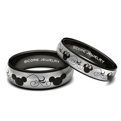 two black and white mickey mouse rings with the words score jewelry printed on them, sitting next to each other