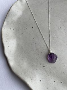 925 sterling silver raw amethyst necklace ✧ Material: 925 sterling silver chain & natural amethyst charm ✧ Chain Length: 16" or 18" ✧ Charm measurements: approx 12-16mm in height  ✧ Packaging: placed into a suede pouch (perfect for gift giving!) Please note slight variations in size and colour may occur as item is a natural gemstone! Minimalist Silver Jewelry With Raw Stone, Silver Amethyst Faceted Necklaces, Silver Amethyst Necklace With Faceted Details, Silver Faceted Amethyst Necklace, Minimalist Amethyst Jewelry For Jewelry Making, Sterling Silver Pendant Necklace With Raw Stone, Sterling Silver Jewelry With Raw Stone For Healing, Healing Sterling Silver Jewelry With Raw Stones, Elegant Sterling Silver Necklace With Raw Stone