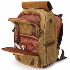 This Canvas Camera Backpack is the perfect choice for photographers and adventurers alike. It features multiple compartments, allowing you to store and organize all your camera gear and other essentials. The large capacity allows you to store a laptop, camera, and other items. The backpack also features a laptop compartment, providing extra protection for your laptop.     ITEM FEATURES   - 1 x Main Compartment - 2 x Front Zipper Pockets - 1 x Laptop Compartment - 1 x iPad Compartment - 1 x Back Zipper Pocket - 2 x Side Bucket Pockets - Thick Airflow Padded Back - Waterproof& Durable - Adjustable Shoulder Strap - Fit Laptop 15.6" - Fit Laptop 9.7" - Trolley Sleeve Design - Tripod Strap Design - Removable Pad Divider - USB Port    ITEM DETAILS   *Item Type: Camera Bag *Material: Waxed Canvas Rectangular Camera Bag For Outdoor, Rectangular Camera Bag For Outdoor Use, Outdoor Camera Bag With Rectangular Shape, Functional Pockets Backpack For Camping, Functional Pocket Backpack For Camping, Photo Backpack, Travel Camera Bag, Summer Leather Sandals, Belly Bag