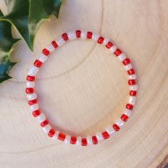 Stunning red and white candy cane design beaded Christmas bracelet. Friendship Bracelets Designs, White Candy, Christmas Bracelet, Bracelet Designs, Pearl Bracelet, Candy Cane, Beaded Bracelet, Friendship Bracelets, Red And White