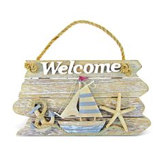 a wooden sign that says welcome with a sailboat and starfish