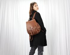 "This Artemis backpack is made with genuine Italian leather in spicy brown. It is fully lined with a cotton fabric. A backpack that you can take everywhere. Perfect for daily use or during your travels. If you have a lot of gear to carry, this fits it all without being bulky. The regular size comfortably accommodates a 13\" laptop while the mini size fits a tablet and a water bottle nicely. You can use the three external zippered pockets, two small ones on the sides and one larger in the back fo Fall Standard Backpack, Leather Backpack For Travel, Fall Season, Brown Leather Backpack For Trip, Brown Backpack For School In Fall, Brown Leather Backpack With Adjustable Strap For Trip, Brown Leather Backpack For School In Fall, Brown Leather School Backpack For Fall, Brown Backpack For Fall, Brown Backpack For Daily Use In Fall