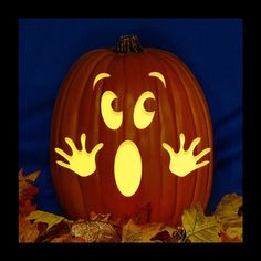 a pumpkin with eyes and hands carved into it