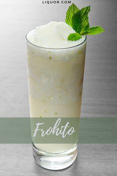 a tall glass filled with ice cream and mint