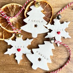 christmas ornaments with orange slices and twine on wooden table