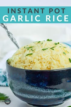 a blue bowl filled with rice on top of a table