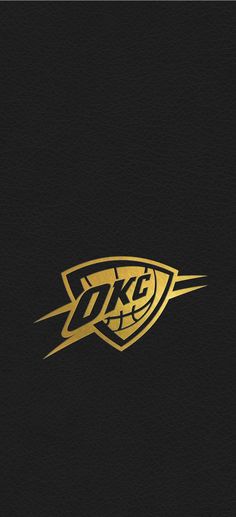 a black and gold logo with the letter dkf on it's side