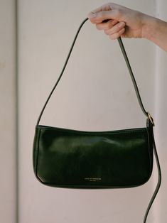 Meet a petite, on-the-go edition of our best-loved baguette bag. An easy-to-carry little number at a perfectly accessible price point. Fabric: Vegan Leather Zip at top Lined Shoulder bag with golden-tone hardware Shipping & Return Free US shipping on orders over $100.Free International shipping on orders over $250. For more details click HERE. Trendy Shoulder Bags, Small Black Bag, Going Out Bag, Green Shoulder Bag, White Linen Top, My Style Bags, Baguette Bag, Pretty Bags, Mini Shoulder Bag