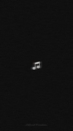 a blurry photo of a music note in the dark