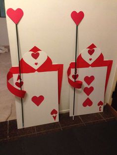 two playing cards with hearts on them are decorated to look like valentine's day