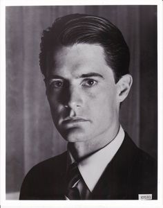 a poster with the image of a man in a suit and tie, missing since june 10, 1971