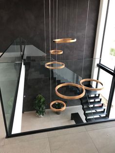 a stair case with circular lights hanging from it