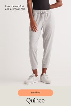 Our favorite performance joggers are a slim fit with the perfect amount of stretch for ultimate comfort. Thick drawstrings, cuffed ankles, and two pocket design give them a premium feel. Our Flowknit fabric is made from Global Recycle Standard poly yarn, which diverts and recycles plastics destined for landfill or the ocean, so you can feel and look good in what you wear.  | Quince | Women's Flowknit Mid-Rise Jogger in Heather Pale Grey, Size XL, Recycled Polyester Everyday Pants, Black Camel, Heather Green, Recycled Fabric, Mulberry Silk, Quince, Pocket Design, Black And Navy, The Ocean