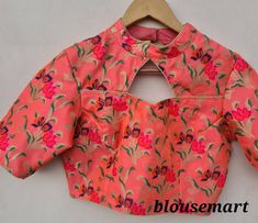 "1. Fabric - Brocade. 2. Peach collared Blouse. 3. Elbow Sleeves blouse. 4. Size in inches - 28\", 30\", 32\", 34\", 36\", 38\", 40\", 42\", 44\", 46\" inches." Multicolor Padded Blouse For Wedding, Fitted Blouse Piece For Spring Wedding, Multicolor Tops For Spring Wedding, Multicolor Spring Wedding Tops, Spring Wedding Multicolor Tops, Traditional Party Blouse With Floral Print, Traditional Floral Print Party Blouse, Pink Spring Wedding Blouse, Fitted Pink Blouse With Floral Print