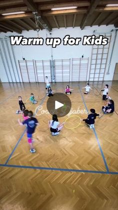 a group of kids are playing basketball in an indoor gym with the words warm up for kids