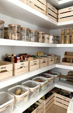 an organized pantry with bins and baskets