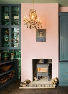 a living room filled with furniture and a fire place next to a wall mounted oven