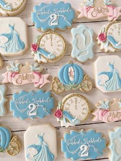 decorated cookies are arranged on a table with the names and numbers for children's birthdays