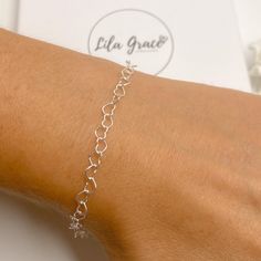 "Super cute sterling silver bracelet made from a heart link chain. Perfect as a gift or treat yourself, the bracelet is adjustable in size, choose your maximum size and then when worn make it a smaller fit by attaching the clasp to any link on the bracelet. Optional jewellery box, perfect if buying as a gift. WHAT YOU GET Bracelet Jewellery Card and Resealable Clear Bag Optional Jewellery Box MEASUREMENTS Each heart link is approx 5mm in size SIZE ONE - max size is 6\" SIZE TWO - max size is 7\" Silver Charm Bracelet With Adjustable Chain For Valentine's Day, Valentine's Day Silver Charm Bracelet With Adjustable Chain, Silver Heart Charm Bracelet For Friendship, Adjustable Silver Chain Bracelet For Valentine's Day, Dainty Silver Bracelets For Valentine's Day, Silver Dainty Bracelet For Valentine's Day, Nickel-free Sterling Silver Bracelet As Gift, Silver Bracelet With Adjustable Chain For Mother's Day, Silver Adjustable Chain Bracelet For Mother's Day