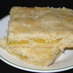 two pieces of cake sitting on top of a white plate