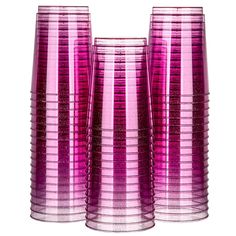 three pink vases sitting next to each other