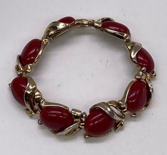 "Beautiful Art Deco Crown Trifari Gold Tone Red Lucite Links Bracelet pre/owned condition measures 7 1/4\" length by 5/8\" width." Vintage Red Bracelet As A Gift, Vintage Red Bracelet For Gifts, Adjustable Red Oval Bracelet, Adjustable Red Oval Bracelets, Red Retro Bangle Jewelry, Vintage Adjustable Red Bracelets, Vintage Red Adjustable Bracelets, Vintage Red Adjustable Bracelet, Red Costume Jewelry Bracelets As Gift